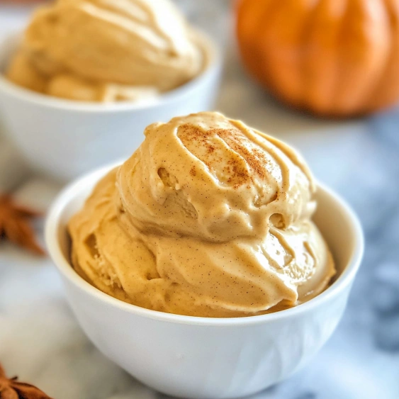 Two bowls of pumpkin ice cream.