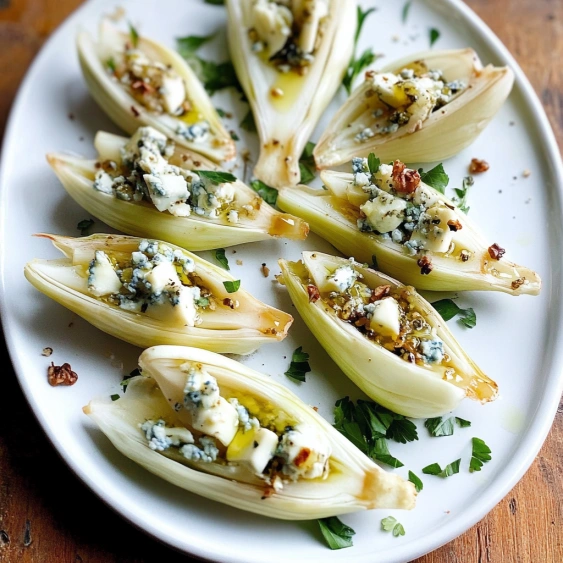 A plate of food with blue cheese on top.