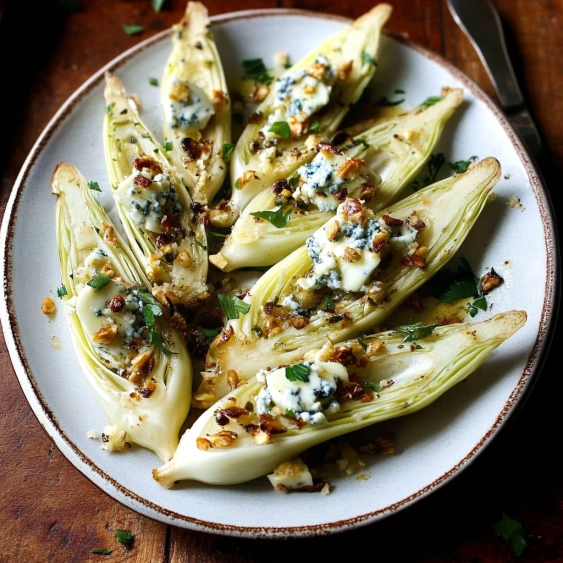 A plate of food with blue cheese on it.