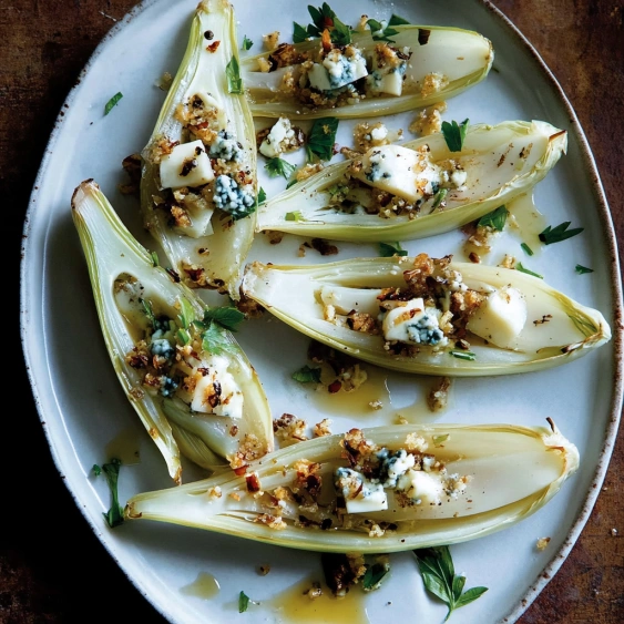A plate of food with a blue cheese sauce.