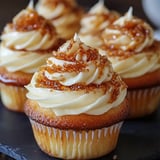 A cupcake with a swirl of frosting on top.