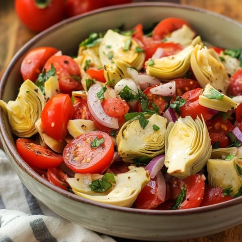 A bowl of vegetables including tomatoes, onions, and lettuce.